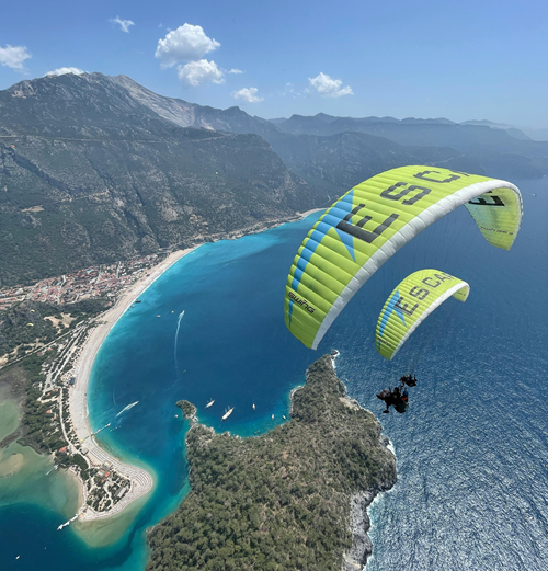 Two paragliders flying